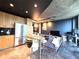 Modern kitchen with stainless steel appliances and dark cabinets at 923 Peachtree Ne St # 1825, Atlanta, GA 30309