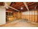 Unfinished basement area with framed walls, concrete floors, and exposed ductwork at 1841 Kanawha Trl, Smoke Rise, GA 30087