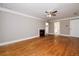 Large main bedroom with hardwood floors, fireplace, and ensuite bathroom access at 1841 Kanawha Trl, Smoke Rise, GA 30087