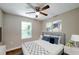 Bright bedroom with hardwood floors and ceiling fan at 1991 Wells Sw Dr, Atlanta, GA 30311