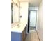 Bright bathroom with vanity and access to hallway at 3465 Leisure Ln, Atlanta, GA 30349