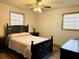 Bedroom with a black bed frame and ceiling fan at 3615 Leisure Lane, Atlanta, GA 30349