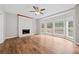 Living room with hardwood floors, fireplace, and large windows at 1238 Sandy Creek Rd, Fayetteville, GA 30214