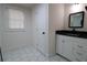 Modern bathroom with white hexagonal tile floor and floating vanity at 1728 Line St, Decatur, GA 30032