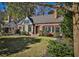 Brick home with stone accents, landscaped yard, and a charming front porch at 204 Heatherdown Rd, Decatur, GA 30030