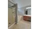 Bathroom features a shower, tub, and vanity at 2897 Hutchins Walk Ct, Snellville, GA 30078