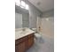 Clean bathroom with vanity, toilet and tub shower combo at 2897 Hutchins Walk Ct, Snellville, GA 30078