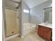 Bathroom with soaking tub, shower, and double vanity at 2897 Hutchins Walk Ct, Snellville, GA 30078