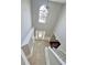 Bright two story foyer with tile floors and elegant chandelier at 2897 Hutchins Walk Ct, Snellville, GA 30078