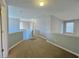 Upstairs hallway with carpet and neutral walls at 2897 Hutchins Walk Ct, Snellville, GA 30078