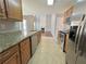 Kitchen with granite countertops, stainless steel appliances, and wood cabinets at 2897 Hutchins Walk Ct, Snellville, GA 30078