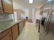 Kitchen with granite countertops, stainless steel appliances, and wood cabinets at 2897 Hutchins Walk Ct, Snellville, GA 30078