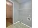 Laundry room with shelving and tile floor at 2897 Hutchins Walk Ct, Snellville, GA 30078