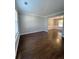 Bright living room with hardwood floors and access to dining area at 2897 Hutchins Walk Ct, Snellville, GA 30078