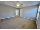 Spacious main bedroom with carpet, ceiling fan and large windows at 2897 Hutchins Walk Ct, Snellville, GA 30078