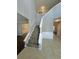 Two-story foyer with a grand staircase and tile flooring at 2897 Hutchins Walk Ct, Snellville, GA 30078