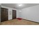 Basement room with two doors and carpet at 4473 Prather Pass Dr, Loganville, GA 30052