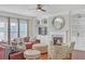 Bright living room with a fireplace, built-in shelving and hardwood floors at 3628 Union Park Dr, Duluth, GA 30097