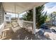 Inviting front porch with a swing, overlooking a tree-lined street at 140 South Se Ave, Atlanta, GA 30315