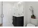 Modern bathroom with white subway tile, walk-in shower, and dark vanity at 3443 Landen Pine Ne Ct, Atlanta, GA 30305