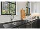 Modern kitchen sink with sleek faucet and dark countertop at 3443 Landen Pine Ne Ct, Atlanta, GA 30305