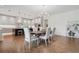 Bright dining room with hardwood floors and large chandelier at 3919 Cash Lndg, Marietta, GA 30066