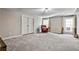 Spacious basement with neutral carpeting and a recliner at 647 Longwood Nw Dr, Atlanta, GA 30305