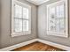 Bright bedroom with hardwood floors and large windows with plantation shutters at 647 Longwood Nw Dr, Atlanta, GA 30305