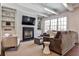 Spacious living room with fireplace, built-in shelving, and hardwood floors at 647 Longwood Nw Dr, Atlanta, GA 30305