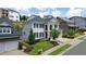 Luxury two-story home with white brick and black shutters at 1010 Coleman Place Dr, Roswell, GA 30075