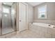 Bathroom featuring a shower, garden tub, and tile flooring at 320 Discovery Lake Dr, Fayetteville, GA 30215