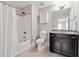 Simple bathroom with shower/tub combo and dark brown vanity at 320 Discovery Lake Dr, Fayetteville, GA 30215