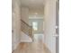 Bright entryway with hardwood floors and a staircase with metal railing at 75 Barge Ln, Covington, GA 30016