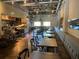 Long, industrial-style restaurant with a bar and many tables at 862 Lakemont Dr, Canton, GA 30114