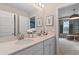 Double vanity bathroom with white cabinets and quartz countertops at 104 Felicity Pike, Locust Grove, GA 30248