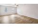 Spacious bedroom with light walls and wood-look flooring at 543 Banks Rd, Fayetteville, GA 30214