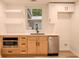 Modern basement kitchenette with light wood cabinets at 851 Flagler Cir, Smyrna, GA 30080