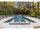 Luxury pool and spa with stone coping and a water feature at 4322 Sentinel Nw Vw, Atlanta, GA 30327