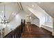 Bright upper hallway with hardwood floors and window at 4322 Sentinel Nw Vw, Atlanta, GA 30327