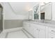 Bathroom with double vanity, gray tile, and mosaic floor at 2624 Forrest Ne Way, Atlanta, GA 30305