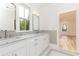 Bathroom with double vanity, marble countertop, and view of bedroom at 2624 Forrest Ne Way, Atlanta, GA 30305