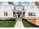 House front view, featuring a wooden garage door and a walkway leading to the entrance at 2624 Forrest Ne Way, Atlanta, GA 30305