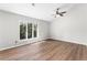 Bright bedroom with vaulted ceiling, wood flooring, and ceiling fan at 15 Ivy Ne Sq, Atlanta, GA 30342