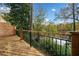 Deck overlooking a lake with fall foliage at 3810 Stonewall Se Ter, Atlanta, GA 30339