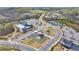 Aerial view of community amenities including pool, tennis courts, and clubhouse at 5732 Cypress Bluff Ln, Hoschton, GA 30548