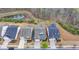 Aerial view of houses with backyard decks and landscaping at 5732 Cypress Bluff Ln, Hoschton, GA 30548