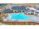 Aerial view of community pool, clubhouse, and tennis courts at 5732 Cypress Bluff Ln, Hoschton, GA 30548
