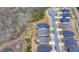 Aerial view of homes and a pond at 5732 Cypress Bluff Ln, Hoschton, GA 30548
