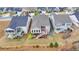 Aerial view of homes with backyard decks and patios at 5732 Cypress Bluff Ln, Hoschton, GA 30548