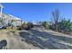 Sloped backyard with sparse grass and a fence at 5732 Cypress Bluff Ln, Hoschton, GA 30548